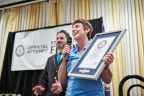 Food Lion President Meg Ham Holds Official Award After Food Lion Sets GUINNESS WORLD RECORDS™ Title for Most Bagged Lunches Assembled in One Hour. Grocer Raises Awareness for Hunger Action Month During Event; Lunches Donated to Local Food Banks (Photo: Business Wire)